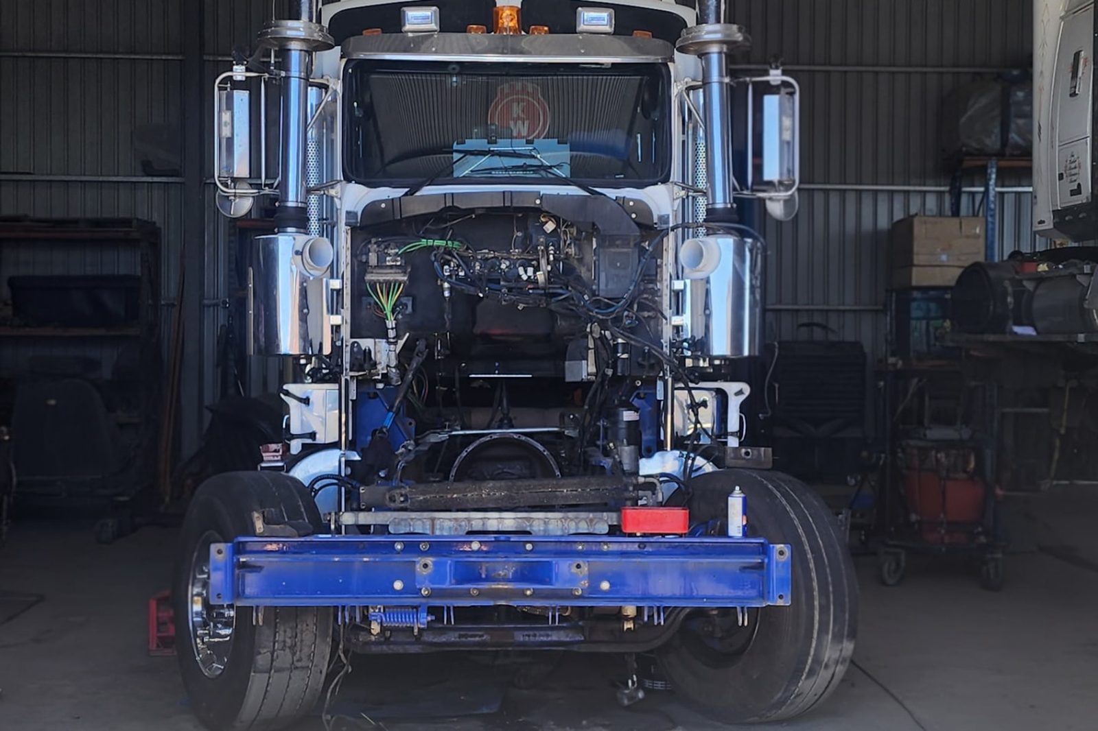 Prime mover with its front end stripped in a shed north of Adelaide during air brake and hydraulic line repairs
